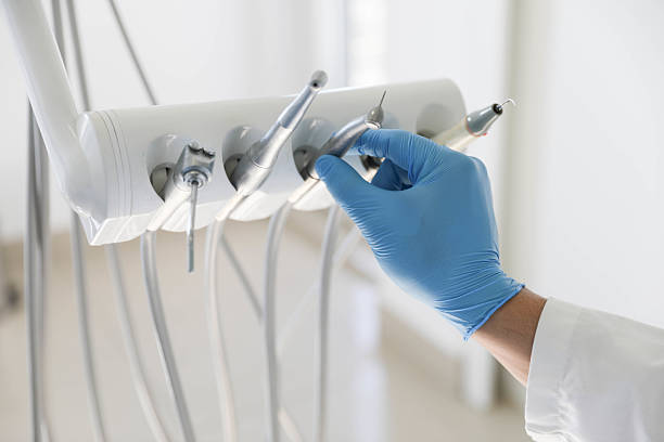Professional Tooth Extraction technician working in Atherton, CA